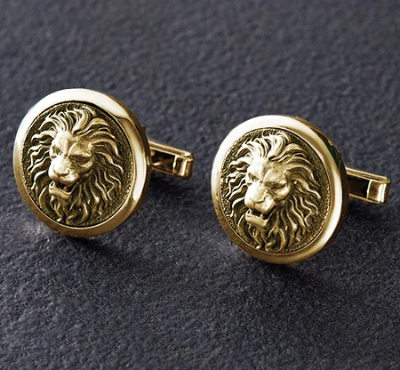 Sols bespoke yellow gold cufflinks with lion bas-relief