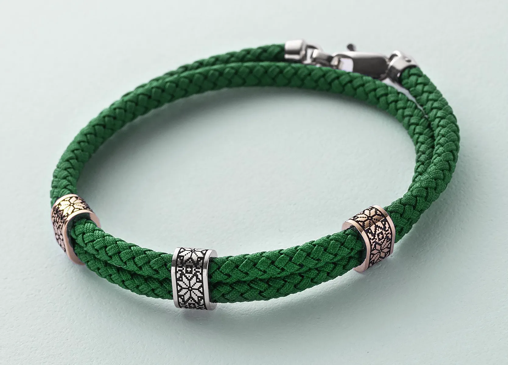 Custom men's cloth bracelet with gold inserts and enamel