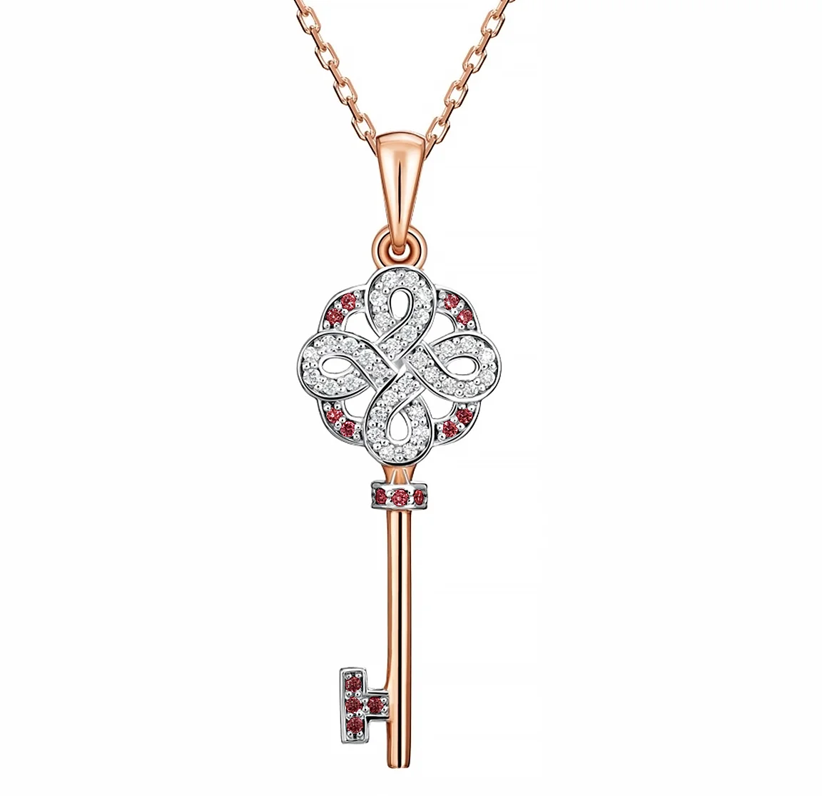 Custom pink and white gold key pendant with diamonds and rubies